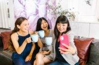 A woman taking selfie with her friends